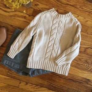 Cropped cable knit sweater